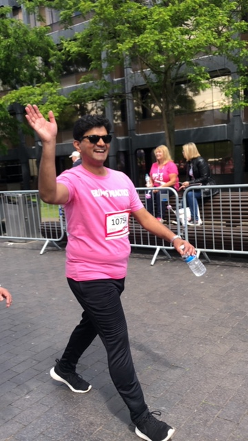 A staff member waving in the race